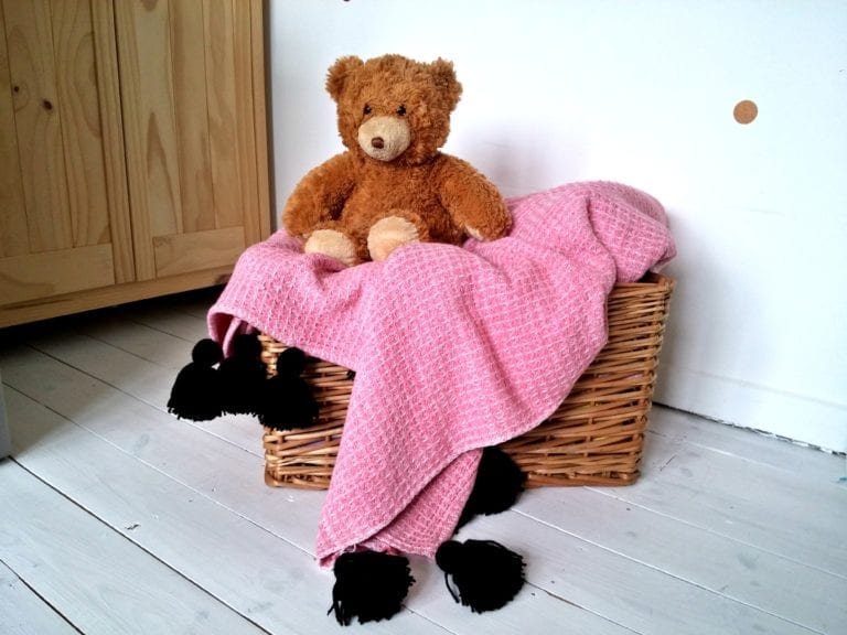 DIY yarn tassel throw